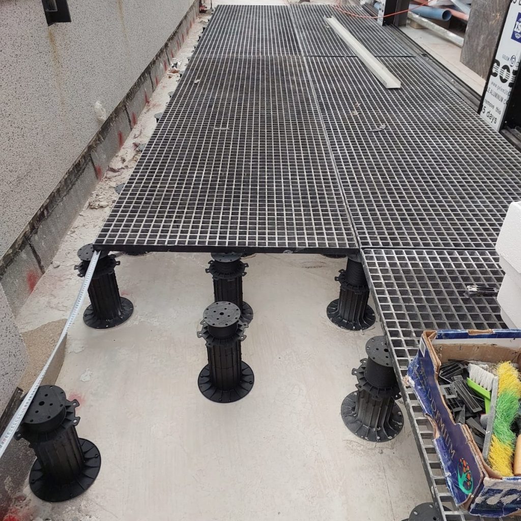 EC pedestals on fiberglass grating. Photo: Eyal Coatings