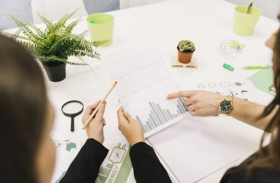 group-businesspeople-analyzing-graph-office